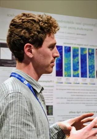 a photo of Tom Arney presenting a poster at a conference